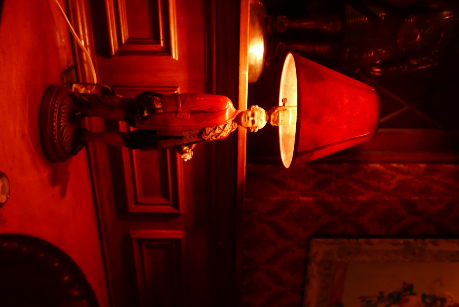 The Prince Bar features a lamp with a statue of a man on it.