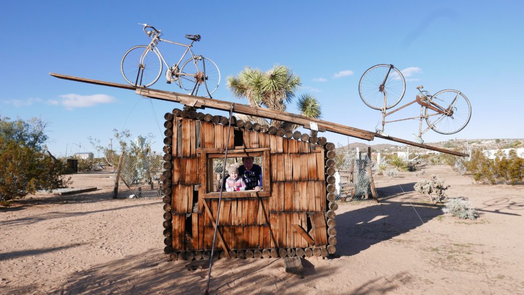 A wooden structure with bicycles on it.