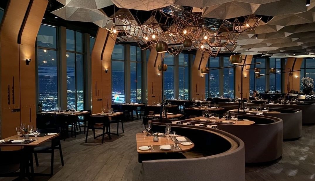 SkySpace/71, a restaurant with a view of the city at night.